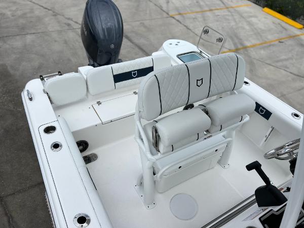 Slide: The Image of 2024 Sea Fox 228 Commander boat interior with dual seats and outboard motor. - 27