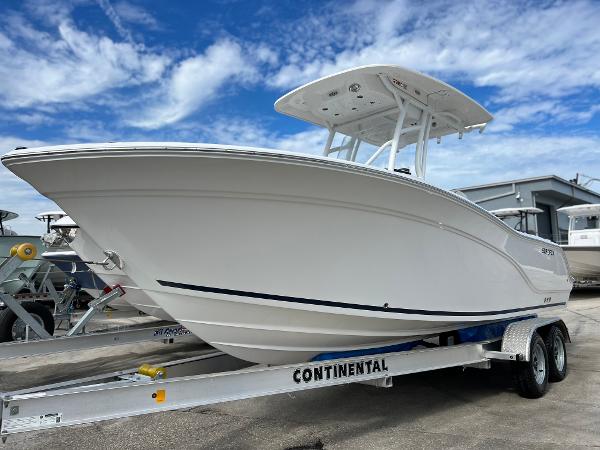 Slide: The Image of 2024 Sea Fox 228 Commander boat on Continental trailer under blue sky. - 3