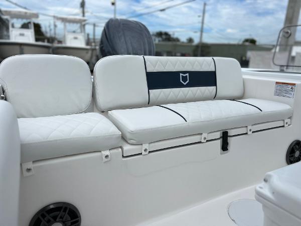 Slide: The Image of 2024 Sea Fox 228 Commander boat with white cushioned seating. - 32