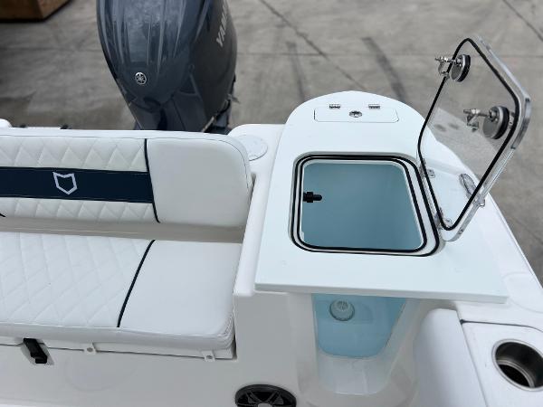 Slide: The Image of 2024 Sea Fox 228 Commander boat interior with seating and storage compartment. - 33