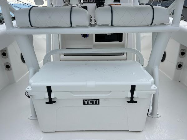 Slide: The Image of 2024 Sea Fox 228 Commander boat with Yeti cooler and cushioned seating. - 39