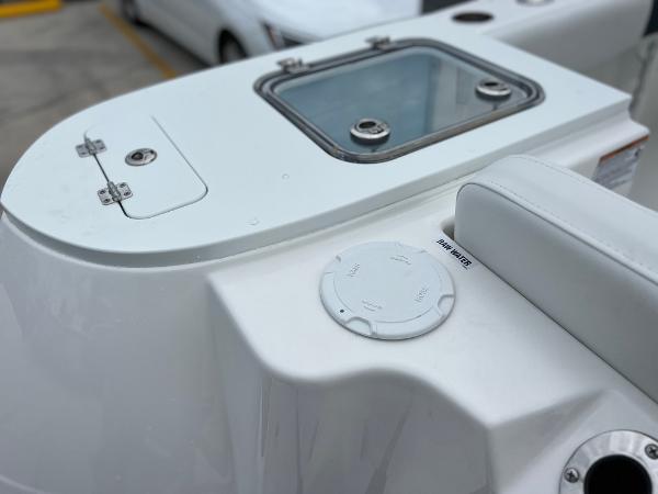 Slide: The Image of 2024 Sea Fox 228 Commander boat deck with storage compartments and seating. - 40
