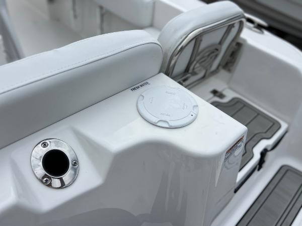 Slide: The Image of 2024 Sea Fox 228 Commander boat interior detail with white seating and stainless steel fixtures. - 41