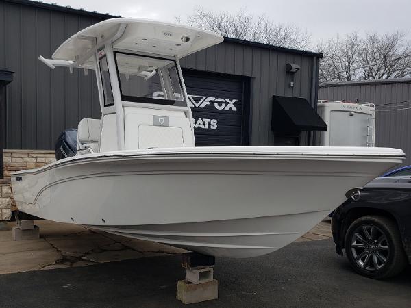 Slide: The Image of 2024 Sea Fox 231 Bay Fox boat displayed outside dealership. - 3