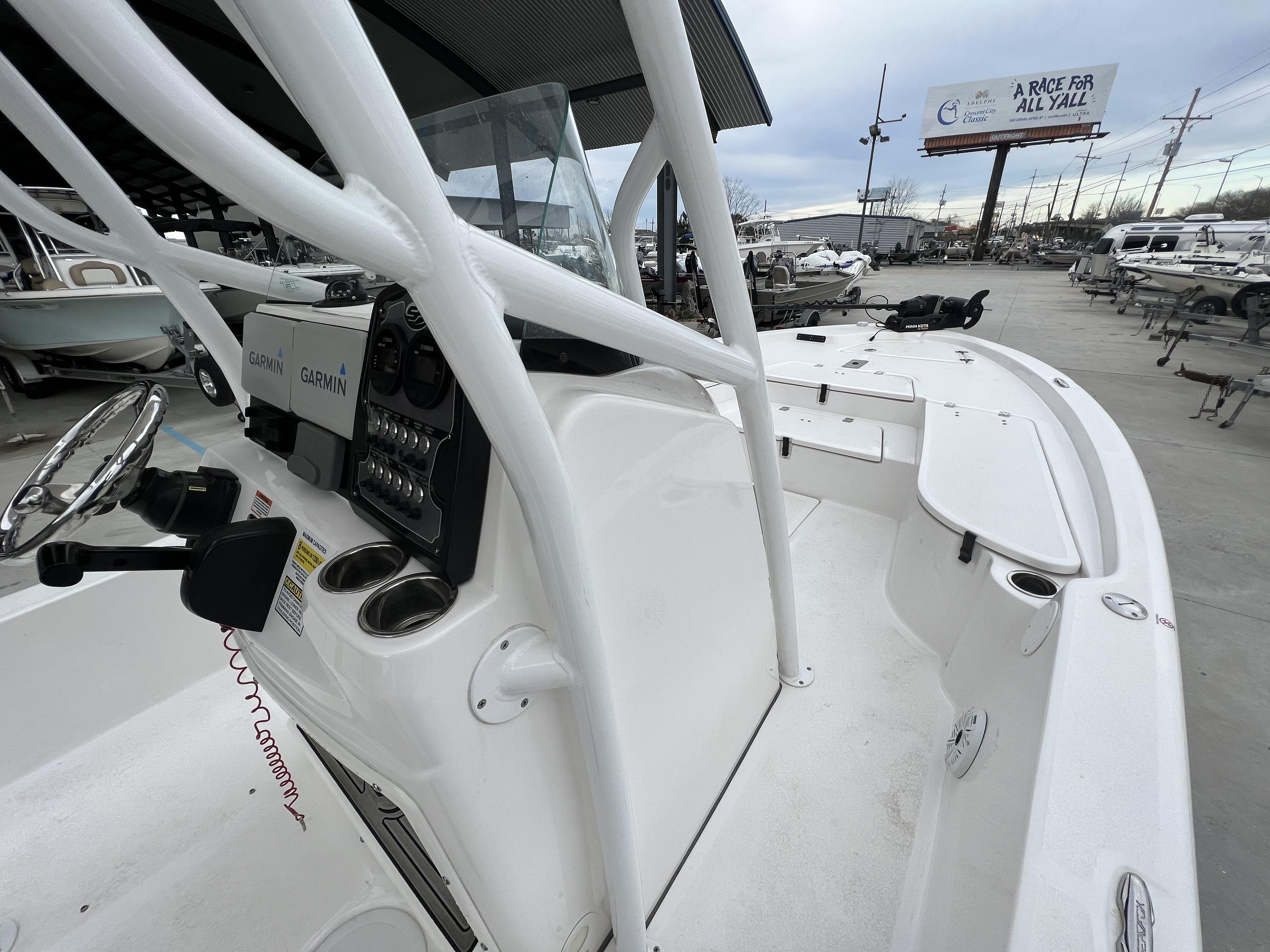 Slide: The Image of 2020 Sea Fox 240 Viper boat interior with Garmin electronics, docked outdoors. - 11