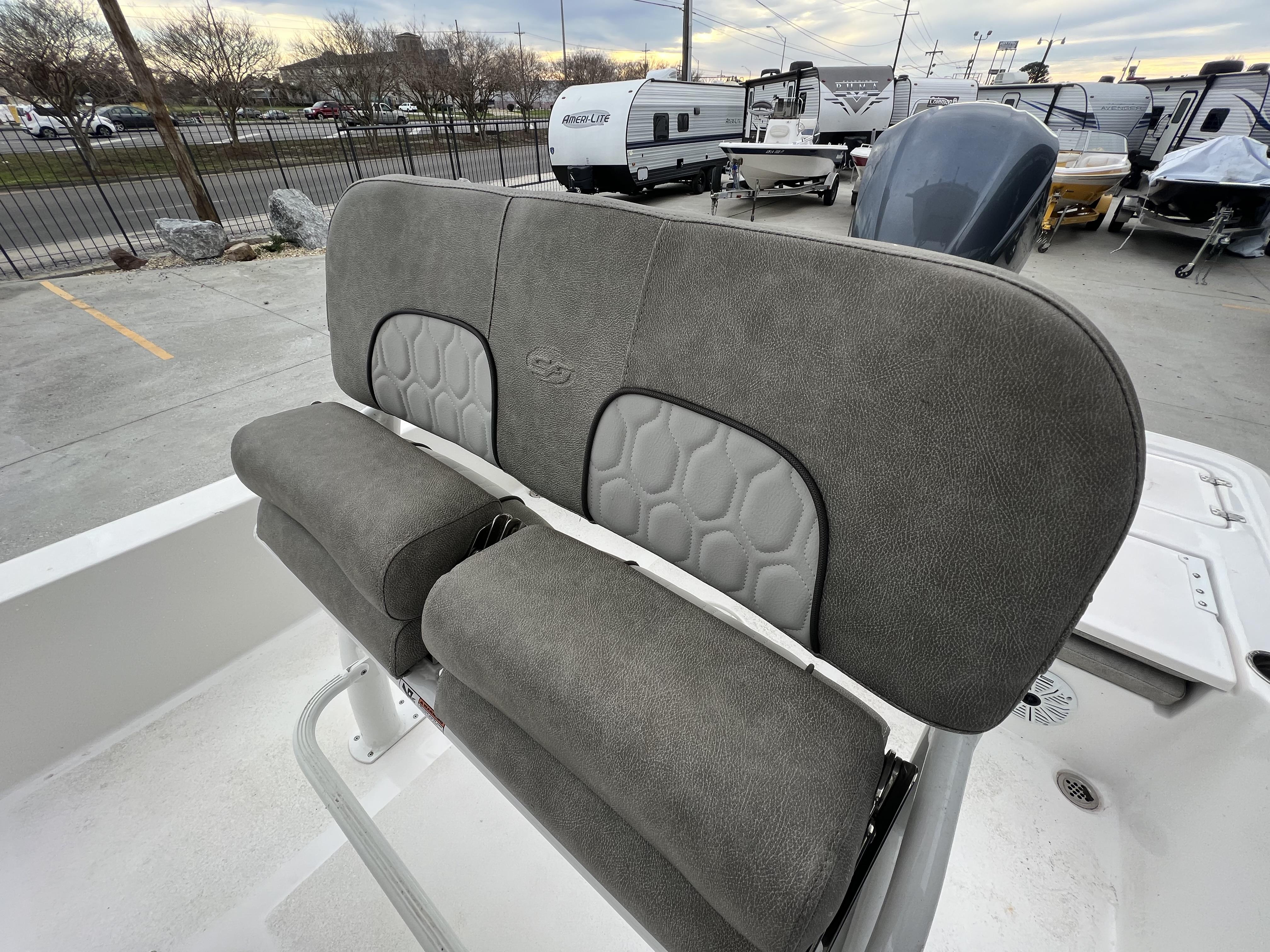 Slide: The Image of 2020 Sea Fox 240 Viper boat seat, gray upholstery, outdoor setting. - 5