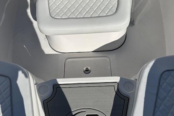 Slide: The Image of 2024 Sea Fox 248 Commander boat interior with cushioned seating and storage. - 7