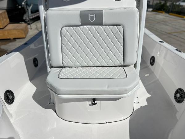 Slide: The Image of 2024 Sea Fox 251 Bay Fox boat with cushioned seating and diamond-stitched upholstery. - 11