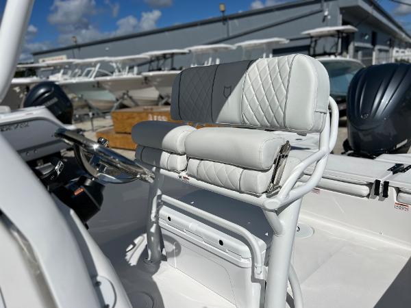 Slide: The Image of 2024 Sea Fox 251 Bay Fox boat interior with white cushioned seating. - 16