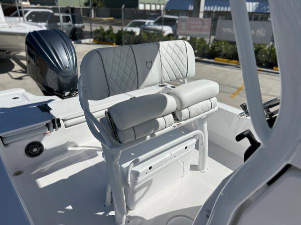 Slide: The Image of 2024 Sea Fox 251 Bay Fox boat with cushioned seating and modern design. - 17