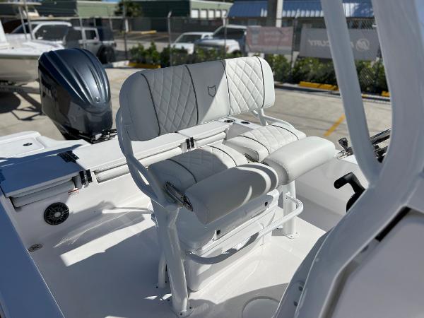 Slide: The Image of 2024 Sea Fox 251 Bay Fox boat with white cushioned seating. - 18