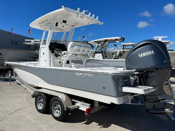 Slide: The Image of 2024 Sea Fox 251 Bay Fox boat with Yamaha engine on trailer. - 2