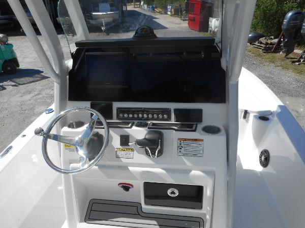 Slide: The Image of 2024 Sea Fox 251 BAYFOX boat console with steering wheel and controls. - 20