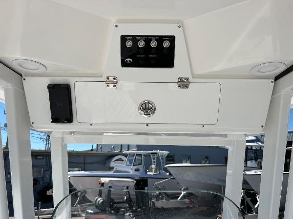 Slide: The Image of 2024 Sea Fox 251 Bay Fox console with control panel and storage compartment. - 23