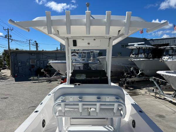 Slide: The Image of 2024 Sea Fox 251 Bay Fox boat at a marina, rear view. - 27