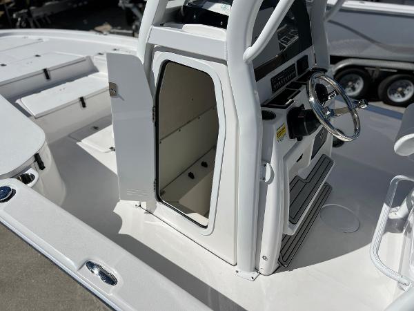 Slide: The Image of 2024 Sea Fox 251 Bay Fox boat interior with open console storage. - 32