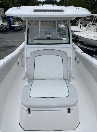 Slide: The Image of 2024 Sea Fox 288 Commander boat with white seating and sleek design. - 13