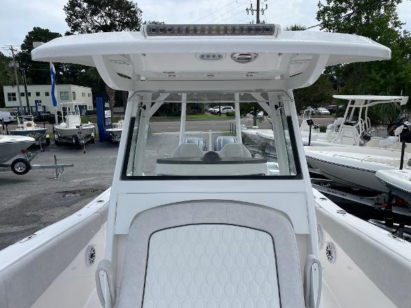 Slide: The Image of 2024 Sea Fox 288 Commander boat, front view at a marina. - 14