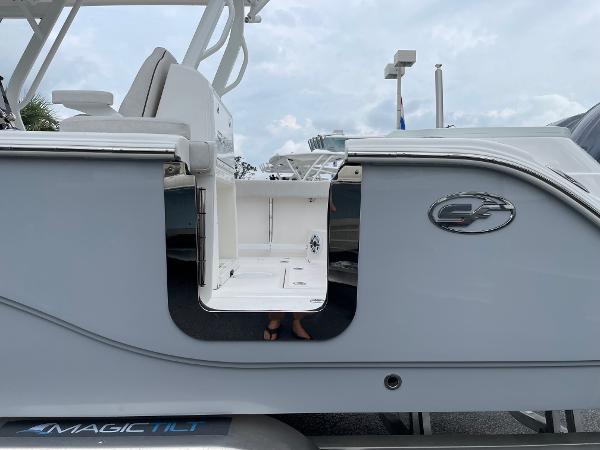 Slide: The Image of 2024 Sea Fox 288 Commander boat side view with logo and seating area. - 20