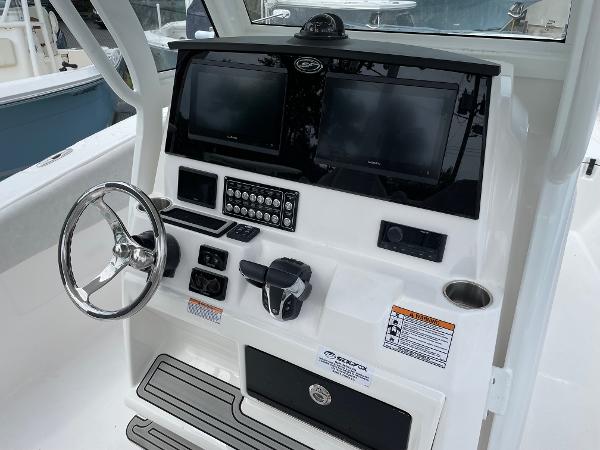 Slide: The Image of 2024 Sea Fox 288 Commander helm with dual screens and modern controls. - 8