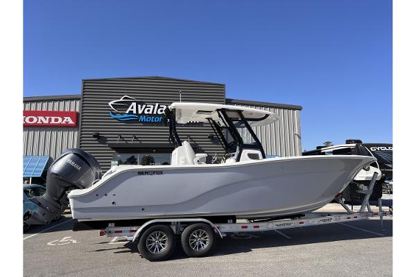 Slide: The Image of 2024 Sea Fox 288 Commander boat on a trailer outside dealership. - 2