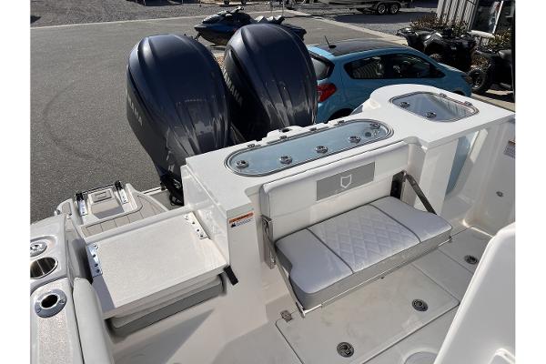 Slide: The Image of 2024 Sea Fox 288 Commander boat with dual outboard engines and seating area. - 5