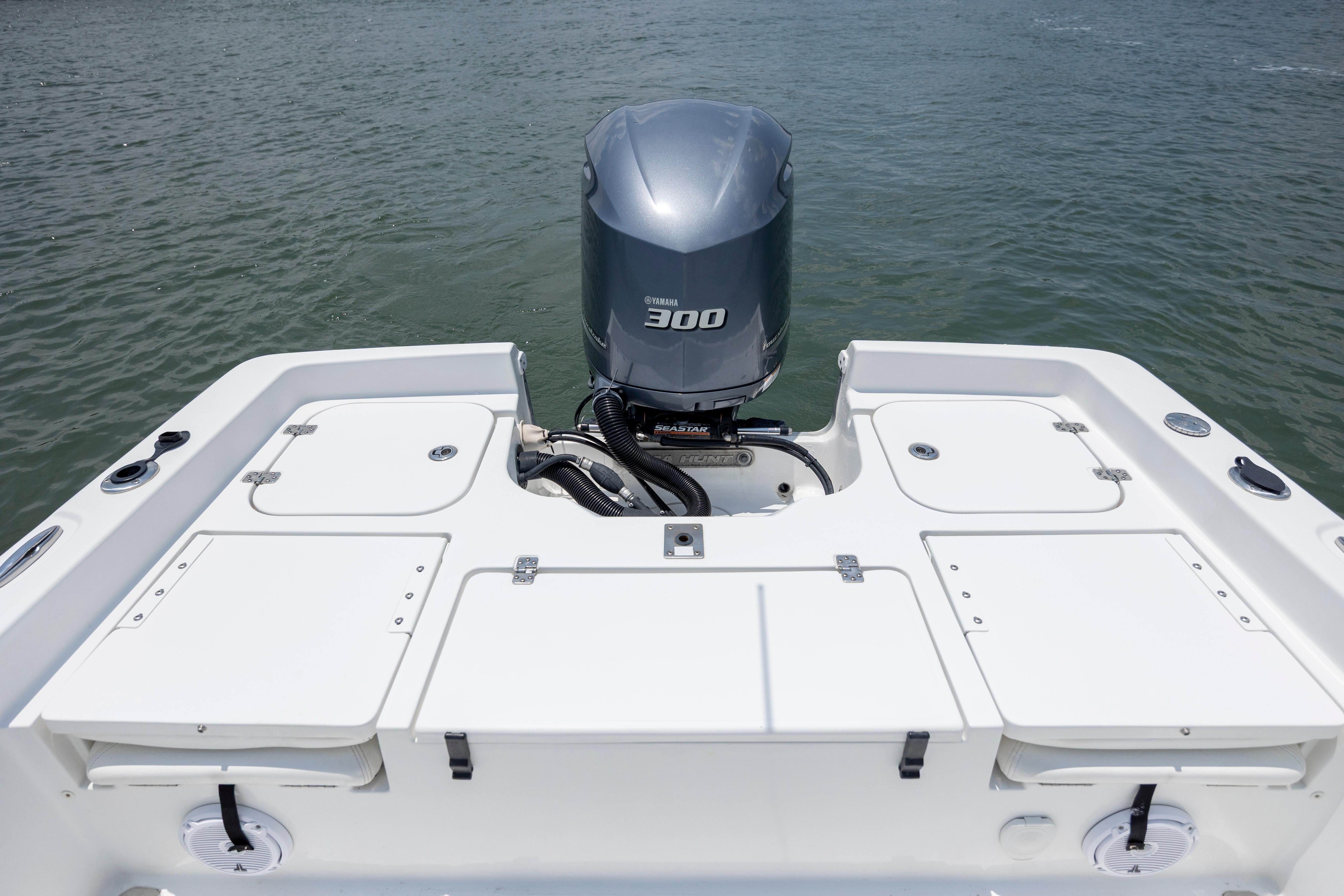 Slide: The Image of 2016 Sea Hunt BX 24 BR boat with Yamaha 300 engine on calm water. - 10