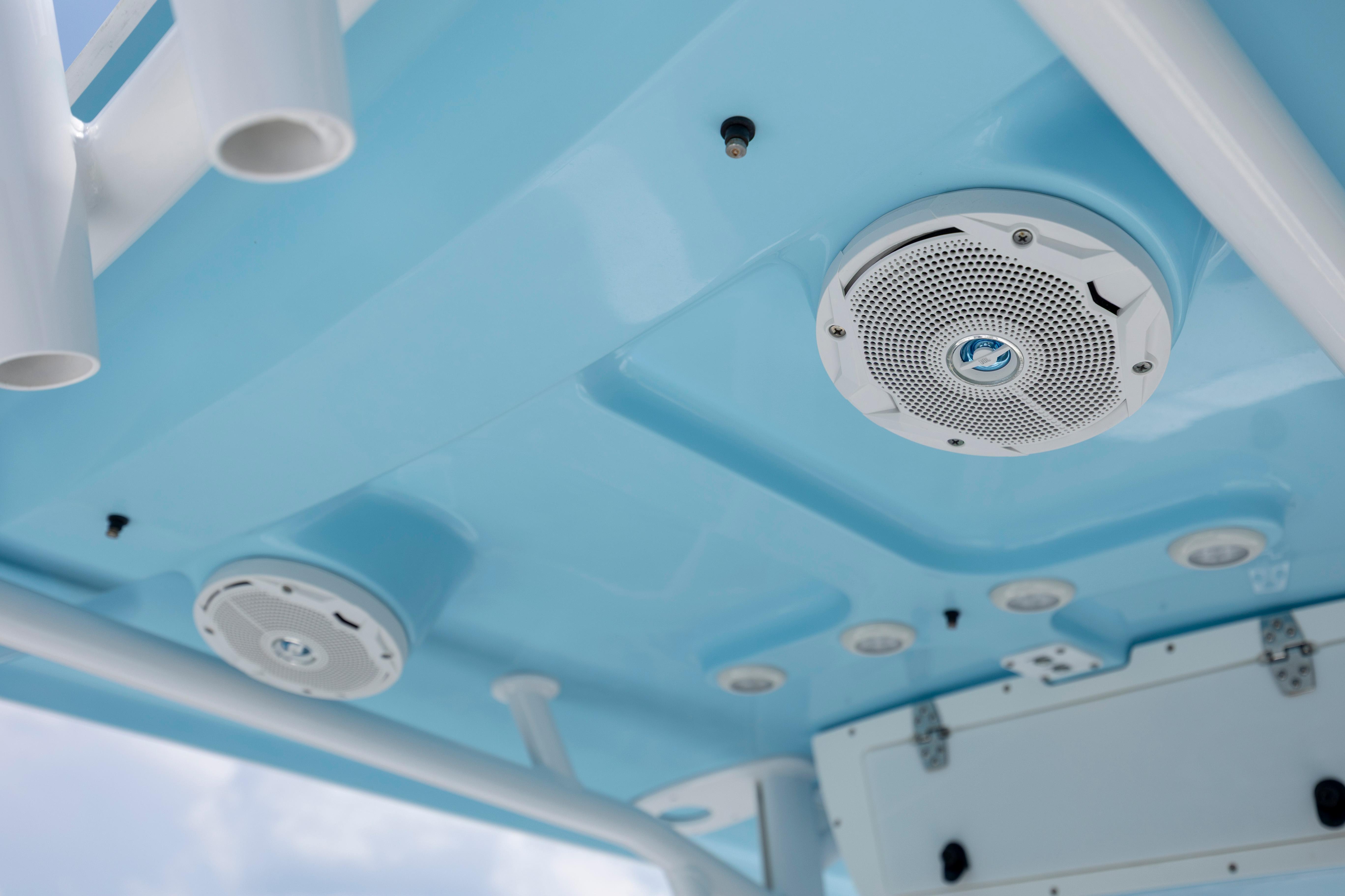 Slide: The Image of 2016 Sea Hunt BX 24 BR boat interior with speaker and rod holders. - 23
