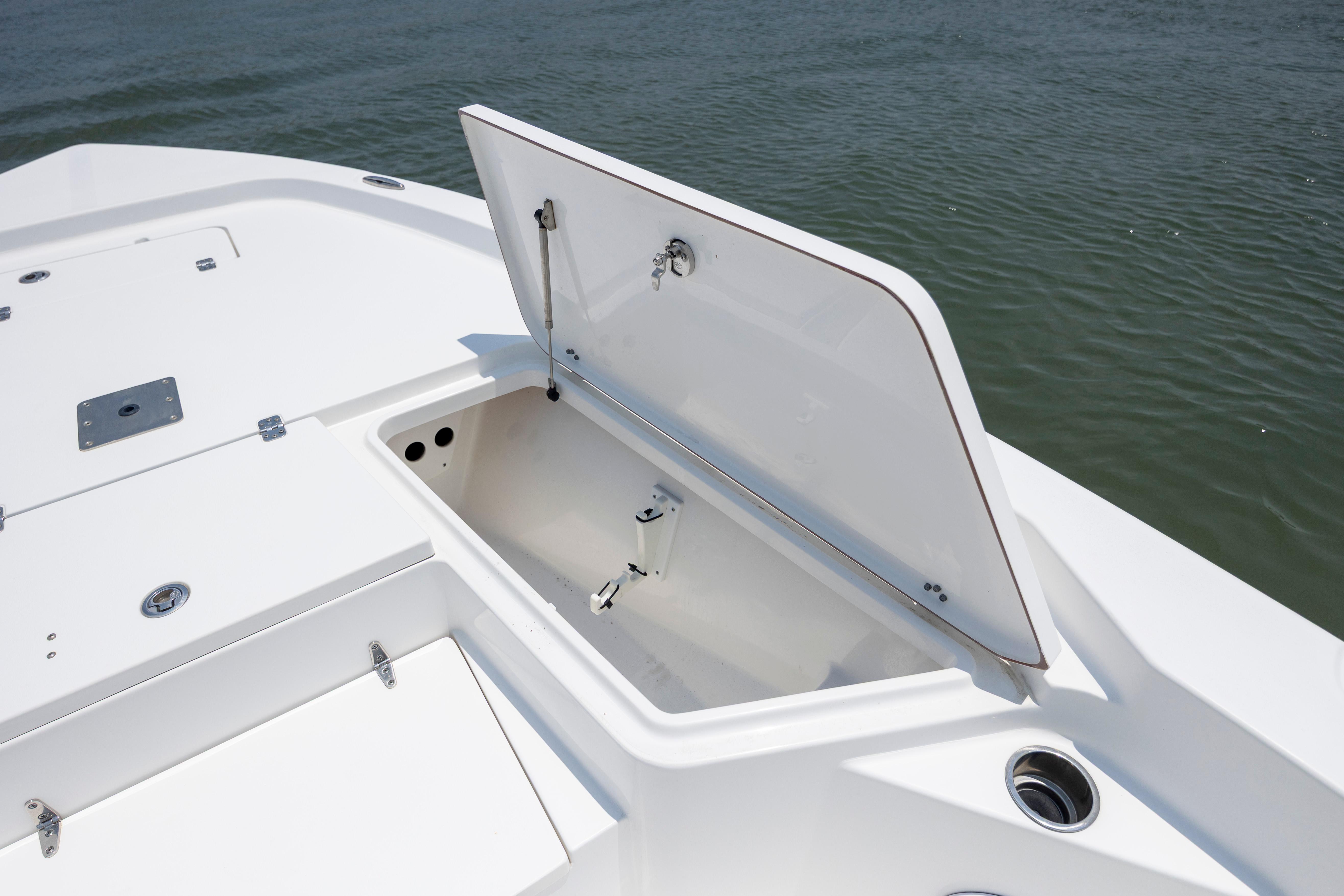 Slide: The Image of Open storage compartment on 2016 Sea Hunt BX 24 BR boat deck. - 26