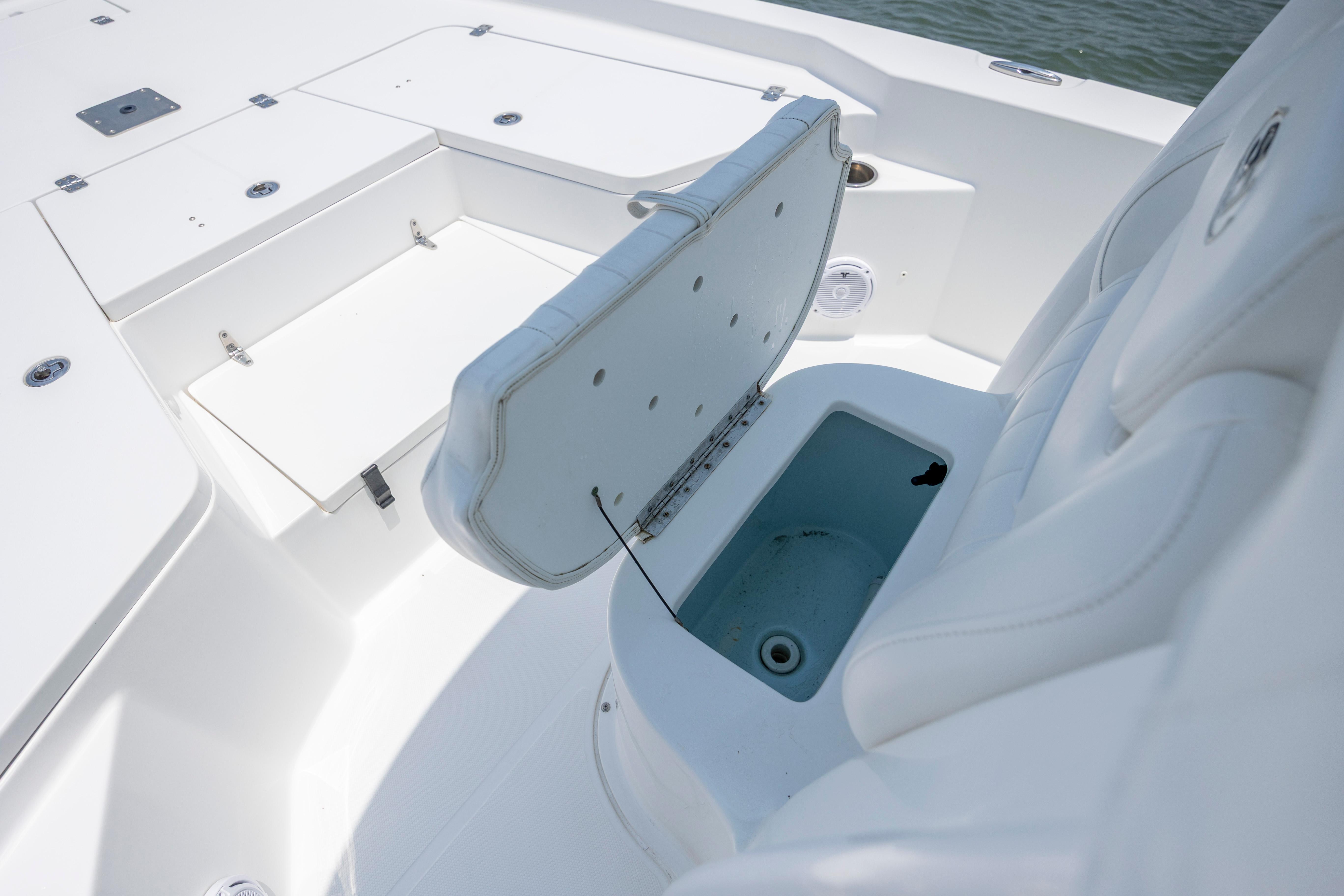Slide: The Image of 2016 Sea Hunt BX 24 BR boat interior with open storage compartment. - 31