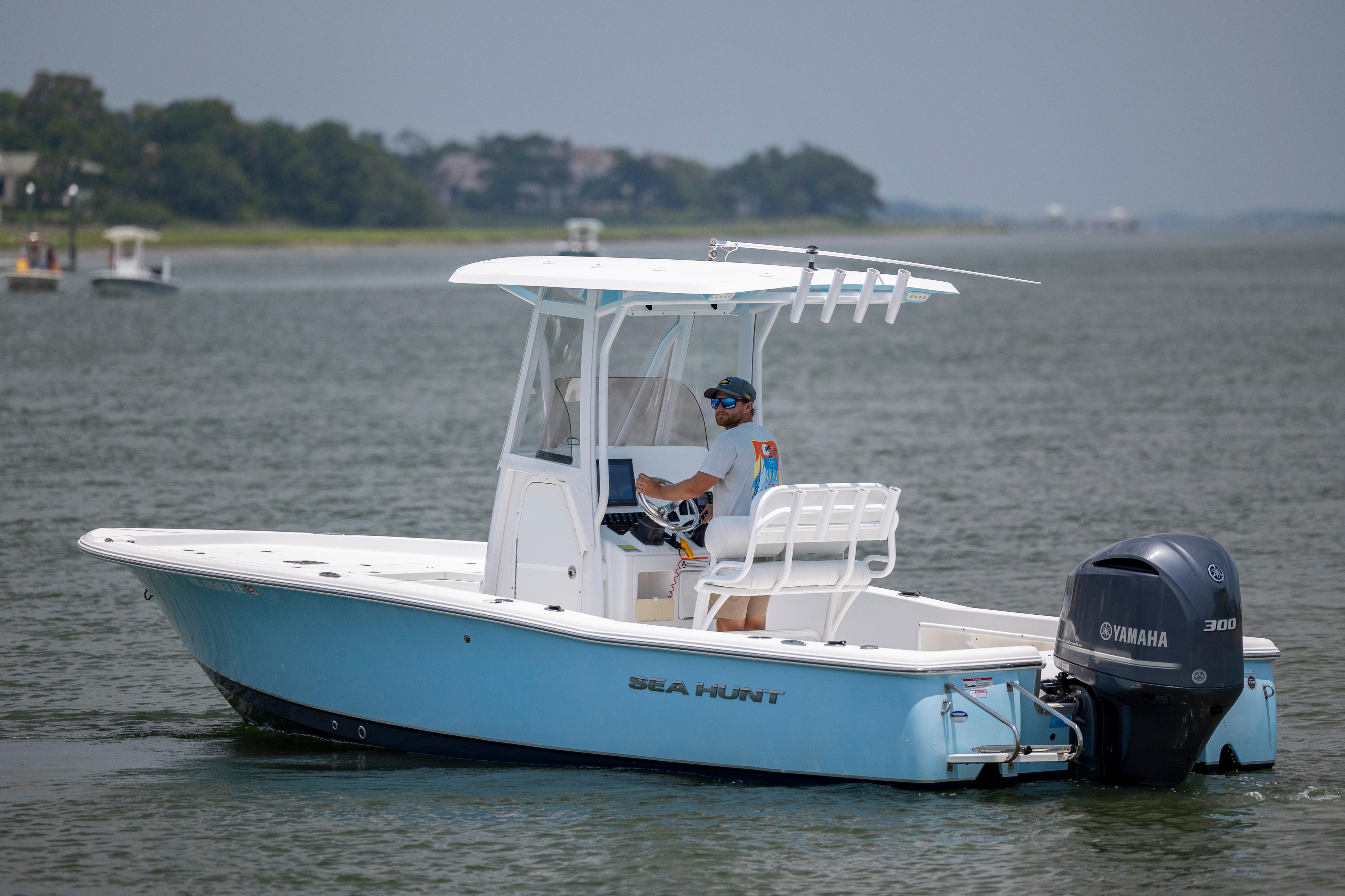 Slide: The Image of 2016 Sea Hunt BX 24 BR boat with Yamaha engine on calm water. - 5