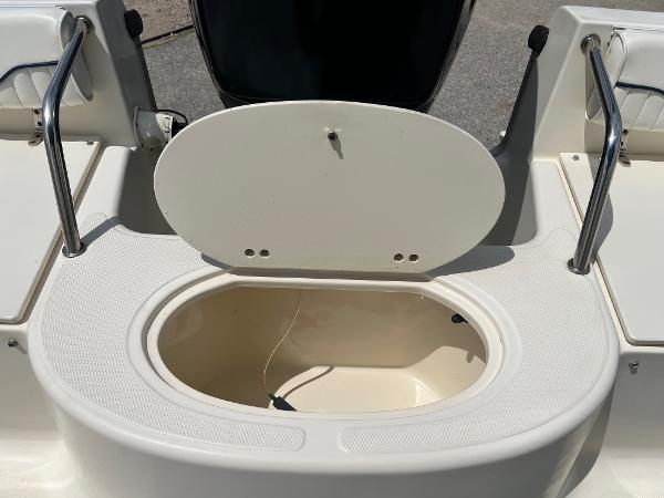 Slide: The Image of Open storage compartment on a 2000 Sea Hunt Escape 200 boat. - 20