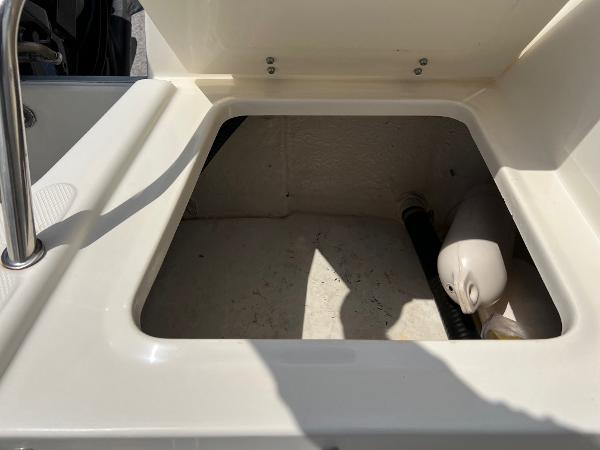 Slide: The Image of Open storage compartment on a 2000 Sea Hunt Escape 200 boat. - 22