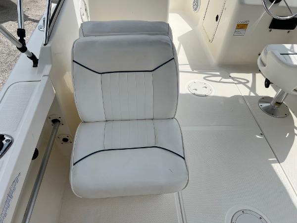 Slide: The Image of White seating on 2000 Sea Hunt Escape 200 boat, featuring clean upholstery and modern design. - 5