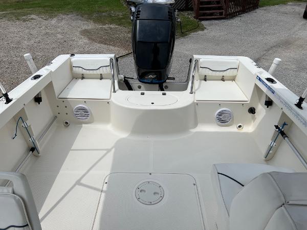 Slide: The Image of 2000 Sea Hunt Escape 200 boat interior with seating and motor, viewed from above. - 7