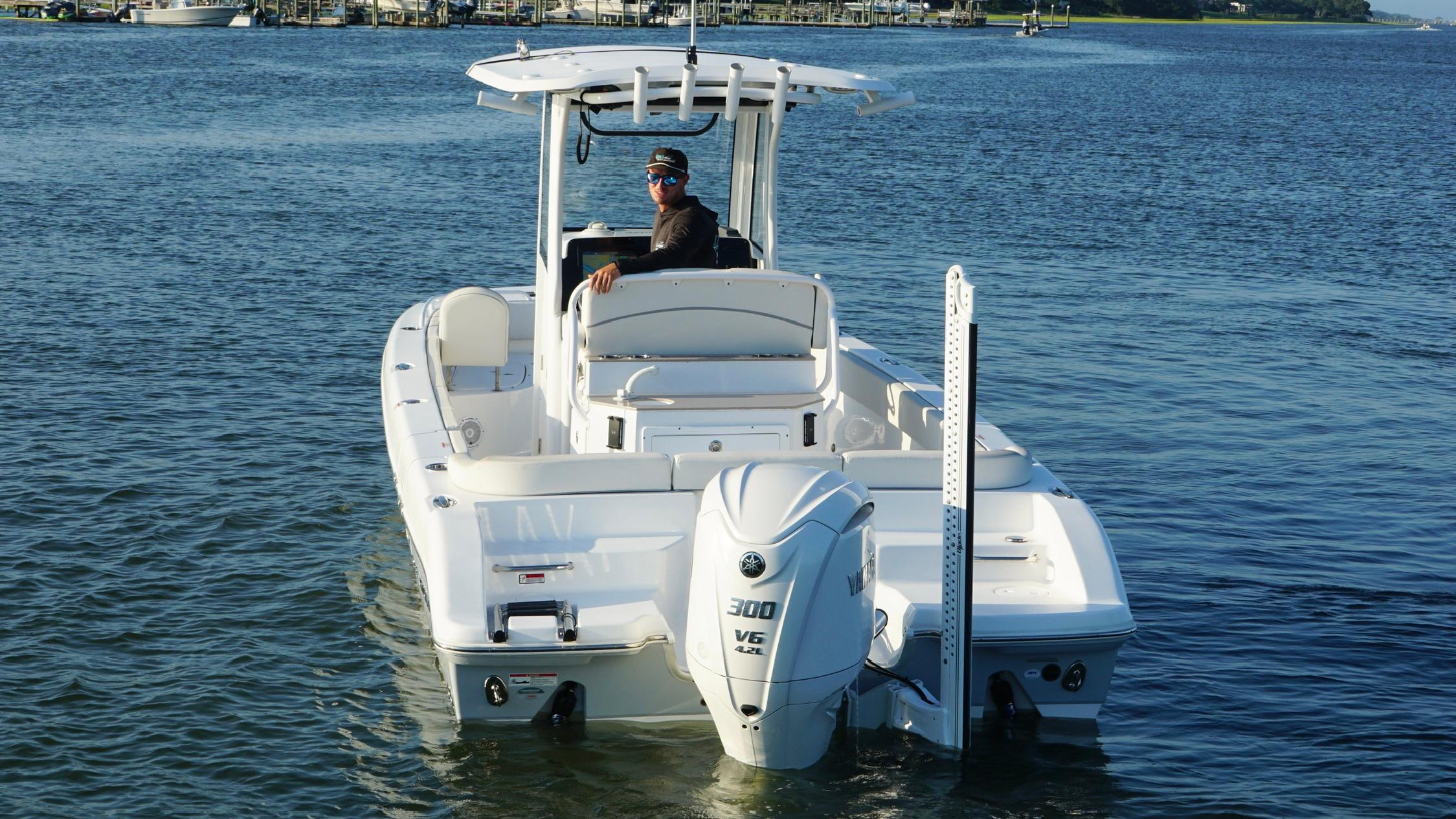 Slide: The Image of 2023 Sea Hunt Escape 25 boat on water, featuring a powerful V6 engine. - 3