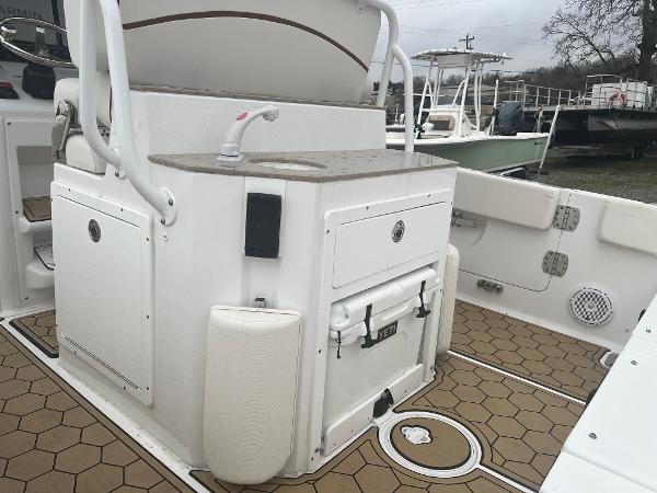 Slide: The Image of Sea Hunt Escape 27 boat interior, 2022 model, featuring a sink and storage compartments. - 8