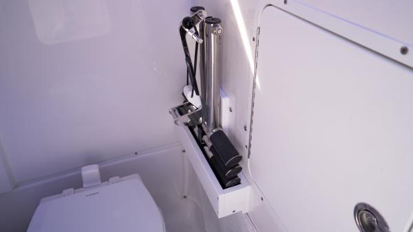 Slide: The Image of Interior of 2025 Sea Hunt Gamefish 27 Coffin Box, featuring storage compartment and hydraulic system. - 32