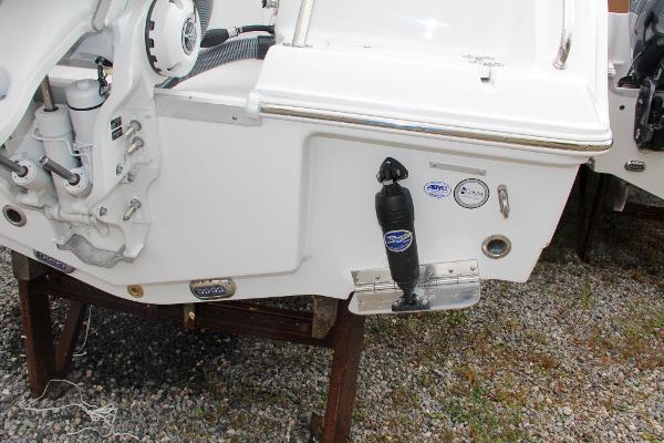 Slide: The Image of 2024 Sea Hunt Ultra 234 boat stern with motor and accessories. - 10
