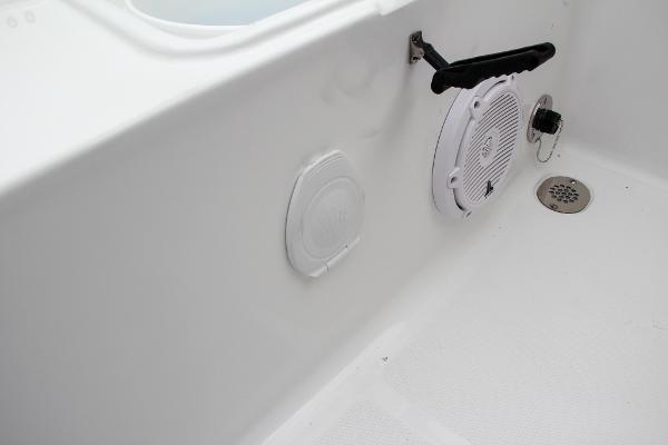 Slide: The Image of Sea Hunt Ultra 234 2024 boat interior with speaker and drain. - 16