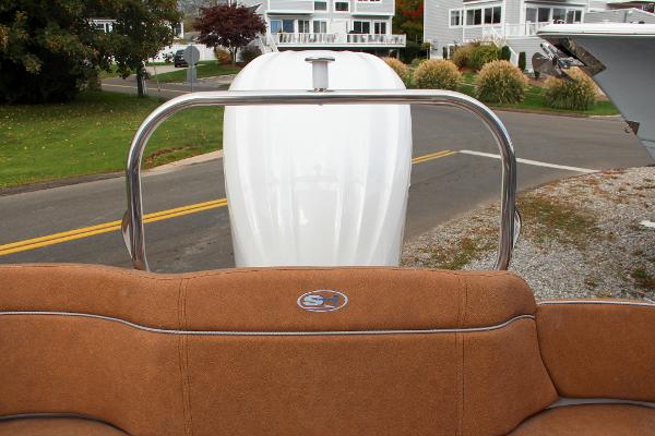 Slide: The Image of 2024 Sea Hunt Ultra 234 boat with brown seating and stainless steel rail. - 19