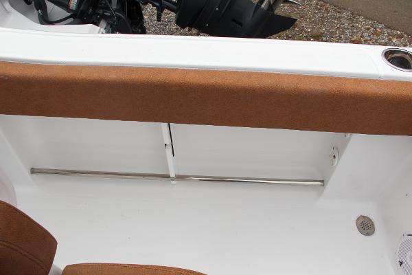 Slide: The Image of 2024 Sea Hunt Ultra 234 boat interior with cushioned seating and stainless steel rod holder. - 26