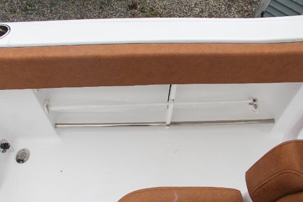 Slide: The Image of 2024 Sea Hunt Ultra 234 boat interior seating and storage compartment. - 27