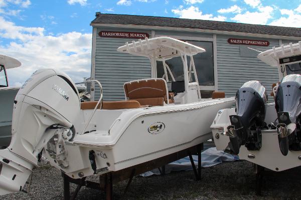 Slide: The Image of 2024 Sea Hunt Ultra 234 boat at Harborside Marina sales department. - 3