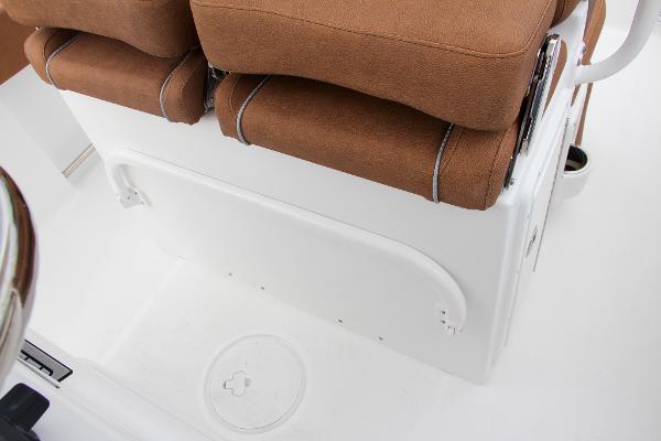 Slide: The Image of 2024 Sea Hunt Ultra 234 boat seating and storage compartment. - 33