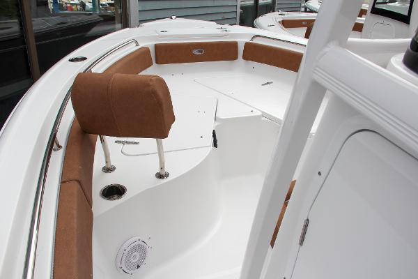 Slide: The Image of 2024 Sea Hunt Ultra 234 boat interior with cushioned seating and storage compartments. - 43