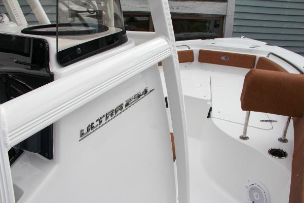 Slide: The Image of 2024 Sea Hunt Ultra 234 boat interior with seating and console. - 44