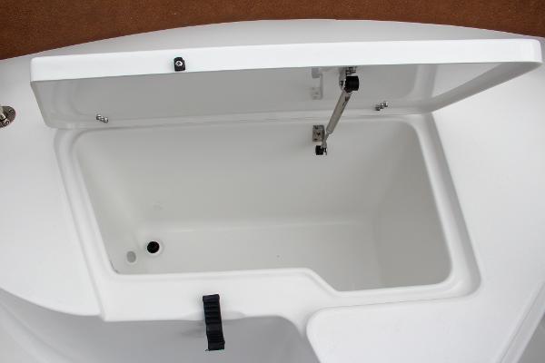 Slide: The Image of Open storage compartment on a 2024 Sea Hunt Ultra 234 boat. - 47