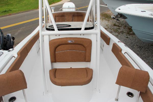 Slide: The Image of 2024 Sea Hunt Ultra 234 boat interior with tan seating and white frame. - 52