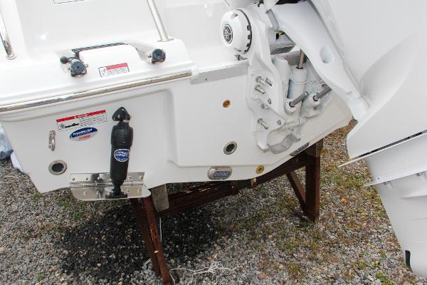 Slide: The Image of 2024 Sea Hunt Ultra 234 boat transom and engine mount on a stand. - 9